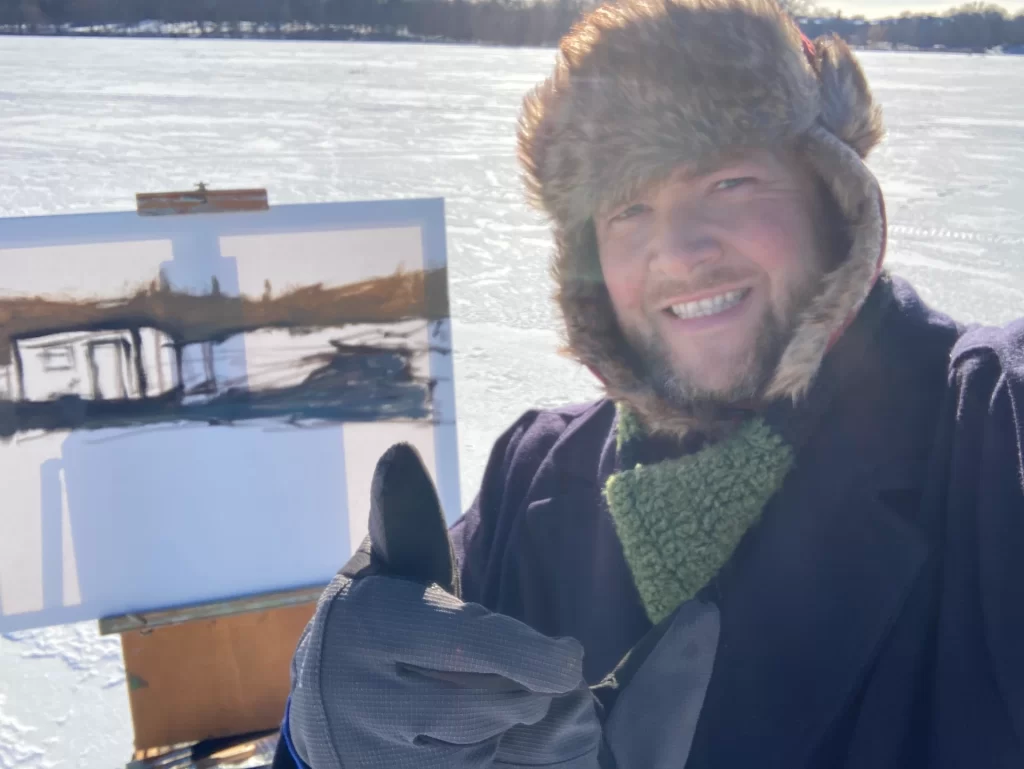Outside painting en plein air in the icy tundra of a lake scene. I am wearing my new wool painters coat like vincent van gogh. 